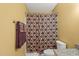 The bathroom features a shower with a curtain and a heated towel rack at 7109 River Birch Dr, Raleigh, NC 27613