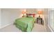 Bedroom with a coordinated bedspread, pillows, and lamps, with carpet floors at 7109 River Birch Dr, Raleigh, NC 27613