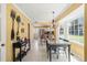 Inviting dining area with large window, chandelier, and view to the kitchen at 7109 River Birch Dr, Raleigh, NC 27613