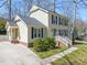 Charming two-story home with classic shutters, brick foundation, and a well-manicured front yard at 7109 River Birch Dr, Raleigh, NC 27613