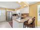 Updated kitchen featuring white cabinetry, granite countertops, stainless steel appliances at 7109 River Birch Dr, Raleigh, NC 27613