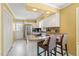 Modern kitchen featuring stainless steel appliances, granite counters, breakfast bar, and outdoor access at 7109 River Birch Dr, Raleigh, NC 27613