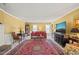 Inviting living room featuring a fireplace, large TV, and a comfortable seating area for relaxation at 7109 River Birch Dr, Raleigh, NC 27613