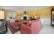 Elegant living room with fireplace, hardwood floors, and a large area rug at 7109 River Birch Dr, Raleigh, NC 27613