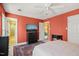 Bedroom with a large window, TV, and ensuite bathroom and connected to another bedroom at 7109 River Birch Dr, Raleigh, NC 27613