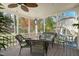Relaxing screened patio with comfortable seating and serene outdoor views at 7109 River Birch Dr, Raleigh, NC 27613