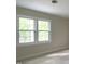 Window provides a view to the beautiful trees and landscaping of the property at 7109 River Birch Dr, Raleigh, NC 27613