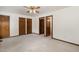 Bedroom with neutral carpet, wood trim and multiple doors at 7212 Rabbit Run, Wake Forest, NC 27587
