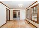 Bright living room with hardwood floors, natural light, fireplace and wood trim at 7212 Rabbit Run, Wake Forest, NC 27587