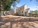 Large back yard featuring lush landscaping, a disc golf basket, and a charming yellow two-story home at 7301 Turtleneck Ct, Raleigh, NC 27616