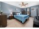 Comfortable bedroom with ample natural light, ceiling fan and plenty of storage at 7301 Turtleneck Ct, Raleigh, NC 27616