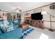 Cozy living room with fireplace, a ceiling fan, and comfortable seating, perfect for relaxation at 7301 Turtleneck Ct, Raleigh, NC 27616