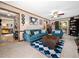 Bright and open living room with comfortable blue furniture, stylish decor, and a cozy ambiance at 7301 Turtleneck Ct, Raleigh, NC 27616