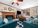 Spacious living room featuring a cozy fireplace, ample seating, and a large flat-screen television at 7301 Turtleneck Ct, Raleigh, NC 27616