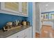 Convenient butler's pantry with glass door cabinets and bar counter at 73214 Burrington, Chapel Hill, NC 27517
