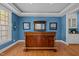 Charming wet bar area with custom woodwork, recessed lighting, and wood flooring at 73214 Burrington, Chapel Hill, NC 27517