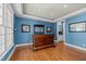 Entertaining space with a custom-built wooden bar, hardwood floors, and elegant lighting at 73214 Burrington, Chapel Hill, NC 27517