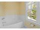 Bright bathroom with tub and window, a clean and inviting space at 73214 Burrington, Chapel Hill, NC 27517
