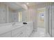 Traditional bathroom with double vanity and tile flooring, offering a classic style at 73214 Burrington, Chapel Hill, NC 27517