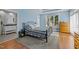 Comfortable primary bedroom with a trey ceiling, wood floors, and natural light at 73214 Burrington, Chapel Hill, NC 27517