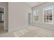 Bedroom with neutral paint, bright natural light, and white trim and door at 73214 Burrington, Chapel Hill, NC 27517