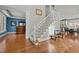 Bright foyer with hardwood floors, staircase, and bench seating at 73214 Burrington, Chapel Hill, NC 27517