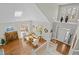 Bright living room with hardwood floors and skylight, offering a welcoming and spacious atmosphere at 73214 Burrington, Chapel Hill, NC 27517
