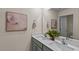 Bright bathroom featuring double sinks, a quartz countertop, and a neutral color palette at 7750 Michelle Rd, Rocky Mount, NC 27803
