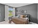 Stylish bedroom with bed, window, and backpack to add unique character at 7750 Michelle Rd, Rocky Mount, NC 27803