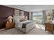 Bright bedroom with a large window, complemented by stylish decor and lamps at 7750 Michelle Rd, Rocky Mount, NC 27803