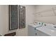 Functional laundry room with modern machines and decor at 7750 Michelle Rd, Rocky Mount, NC 27803