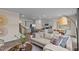 Open-concept living room showcases grey cabinets and an island with barstool seating at 7750 Michelle Rd, Rocky Mount, NC 27803