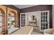 Open and airy office space with custom shelving and a view to the foyer at 7750 Michelle Rd, Rocky Mount, NC 27803