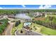 Aerial view showcasing a community with a pool, playground, and lake at 825 Golden Plum Ln, Zebulon, NC 27597