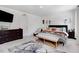 Well-lit bedroom with neutral carpet, comfortable furnishings, and stylish décor at 825 Golden Plum Ln, Zebulon, NC 27597