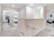 Upstairs hallway with views into bedrooms on either side at 825 Golden Plum Ln, Zebulon, NC 27597