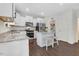 Bright kitchen with white cabinetry, granite countertops, and stainless steel appliances at 825 Golden Plum Ln, Zebulon, NC 27597