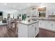 Kitchen and dining area with hardwood floors and bright natural lighting at 825 Golden Plum Ln, Zebulon, NC 27597