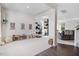 Spacious living room with white walls, plush carpet, and ample natural light at 825 Golden Plum Ln, Zebulon, NC 27597