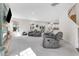 Spacious living room featuring comfortable reclining couches and lots of natural light at 825 Golden Plum Ln, Zebulon, NC 27597