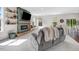 Cozy living room features a modern fireplace, built-in shelves, and comfortable seating at 825 Golden Plum Ln, Zebulon, NC 27597