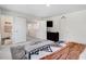 Bedroom with decorative rug, and views into hallway at 825 Golden Plum Ln, Zebulon, NC 27597