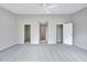 Spacious bedroom featuring doorways to closets and neutral carpeting at 8641 Neuse Club Ln # 110, Raleigh, NC 27616