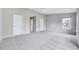 Large carpeted bedroom featuring neutral gray walls at 8641 Neuse Club Ln # 110, Raleigh, NC 27616