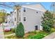 Townhome with vinyl siding, tidy landscaping, and a well-maintained lawn at 8641 Neuse Club Ln # 110, Raleigh, NC 27616