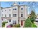 Well-maintained townhome featuring tidy landscaping and a welcoming front entrance at 8641 Neuse Club Ln # 110, Raleigh, NC 27616
