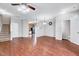 Spacious living area flowing to kitchen with stairs, half bathroom, and neutral walls at 8641 Neuse Club Ln # 110, Raleigh, NC 27616