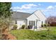 Relaxing backyard with patio seating, grill, manicured lawn, and attractive landscaping at 8701 Neuse Village Ct, Raleigh, NC 27616