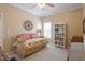 Bright bedroom with a daybed, bookcase, and natural light from the window at 8701 Neuse Village Ct, Raleigh, NC 27616