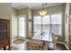 Cozy dining area with a wooden table, natural light, and stylish decor at 8701 Neuse Village Ct, Raleigh, NC 27616